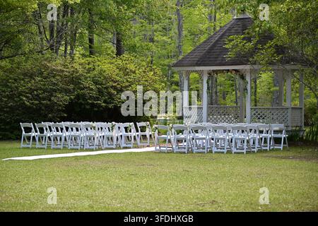 Outdoor Wedding Ceremony Setup with White Gazebo in South Carolina, USA Stock Photo