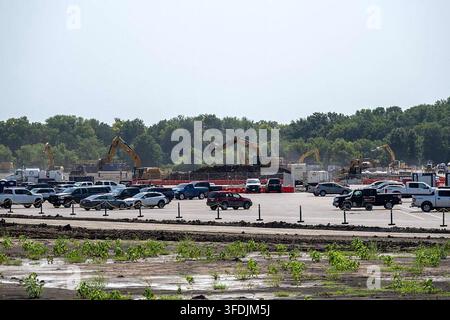 Multiple Caterpillar excavators work atop a large mound of excavated soil at the Nebius data center construction site, viewed from North Bly Road in Independence, Missouri, on August 13, 2026. Construction is underway on the new Nebius data center facility, a major technology infrastructure project in the Kansas City metropolitan area. (Photo by Emily Curiel/The Kansas City Star/TNS/Sipa USA) Stock Photo