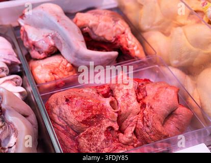 Fresh raw lungs packed in plastic tray on display in refrigerated meat section of grocery store Stock Photo