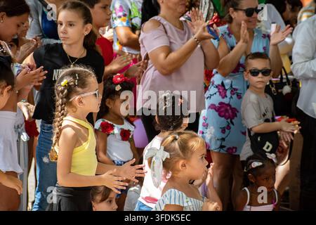 Children and Families Clapping and Enjoying a Show During El Carnavalito Festival on August 21 2026 in Ciego de Avila Cuba Stock Photo