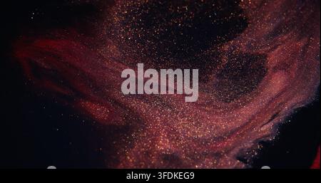 Glitter paint. Fluid art. Defocused purple red color shiny blend pigment sparkling texture spilling on abstract dark background. Stock Photo