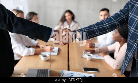 Handshake At Business Meeting, Two Businessmen Shaking Hands In Office Stock Photo