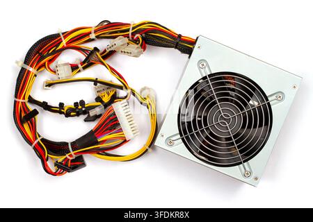 Computer power supply unit with cables and fan. Hardware component for desktop PC assembly. Electronic device for energy distribution and cooling. Stock Photo