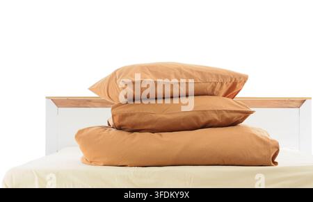 Sleep hygiene and comfort, stack of brown pillows and folded duvet on a bed for home interior design and bedroom relaxation Stock Photo