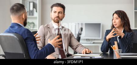 Corporate collaboration and team communication, diverse business professionals in a meeting discussing strategy and project planning in a modern offic Stock Photo