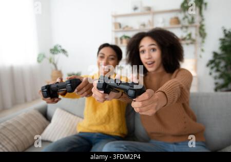 Xbox, enjoying of playing in video game on playstation and rest at home Stock Photo