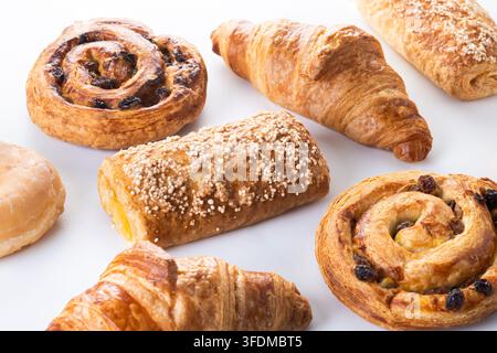 Assorted pastries and donuts isolated on white background Stock Photo