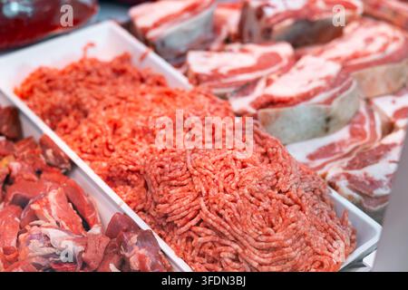 Ground meat in tray displayed in store meat counter Stock Photo