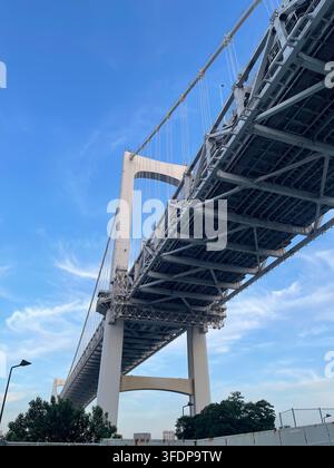 Low angle view of Rainbow Bridge from the pedestrian walkway in Tokyo, Japan Stock Photo