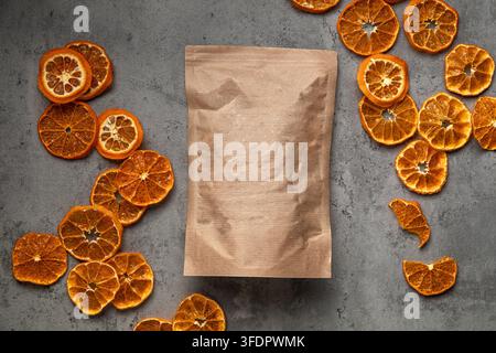 Kraft paper pouch with dried orange slices Stock Photo