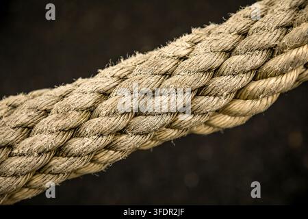 Worn old rope remains strong evoking memories of traditional sailing ships and life at sea Stock Photo
