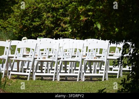 Rows of White Chairs Prepared for Outdoor Wedding Ceremony in South Carolina, USA Stock Photo