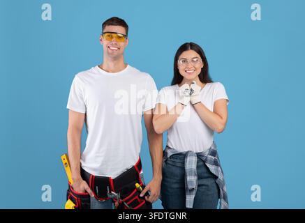 Portrait Of Happy Excited Couple Wearing Safety Glasses Ready For Repair, Stock Photo