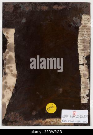 A fragment of a 19th-century portrait photograph, dated 1853, with a rough, mottled surface, accompanied by a yellow circular sticker and a white rectangular label with a red stamp. Stock Photo