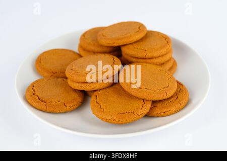 Ginger Biscuits on a white plate,The Ginger nuts or Ginger snaps are on a white background Stock Photo
