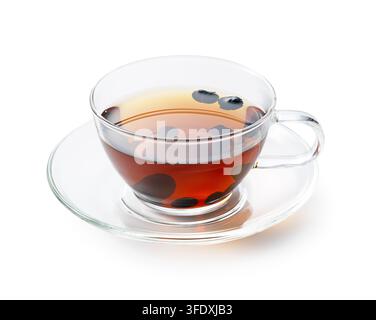 Black Soybean Tea in Clear Glass Teacup with Saucer Isolated on White Background Stock Photo