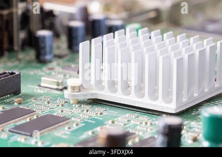 Close-up of an aluminum heatsink mounted on a computer motherboard Stock Photo