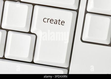 Enter key with create text symbolizing digital creativity and content production Stock Photo