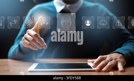 Person interacts with tablet displaying digital icons related to technology and deep fake applications Stock Photo