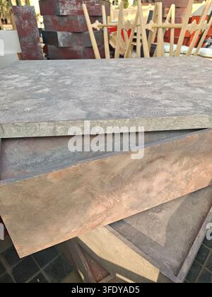 Stacked stone tiles show textured, weathered surfaces. Gray and brown tones suggest natural, rustic materials Stock Photo