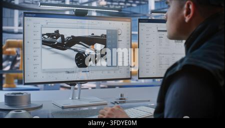 Operator Manages Automated Production Workflows and 3D Component Blueprints on Dual Screens in Smart Plant. Advanced Robotics and Engineering Optimize Digital Heavy Industry Processes. Industry 4.0. Stock Photo
