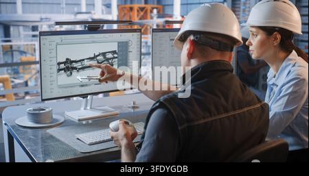 Female Specialist Points to CAD Graphics on Screen as Male Engineer Checks Machined Part with Caliper. Quality Assurance and Digital Twin Technology Optimize Smart Factory Automotive Workflows. Stock Photo