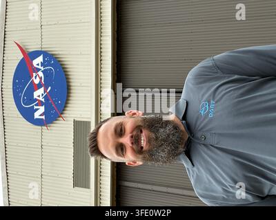 Eric Fernandez, a telemetry engineer for NASA's Launch Services Program, stands in front of Building 836 at Vandenberg Space Force Base in California, where he works on bringing signals to NASA, specifically handling spacecraft data. Stock Photo
