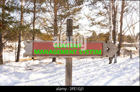 Content management system symbol. Concept words Content management system on beautiful road sign. Beautiful winter forest background. Business content Stock Photo