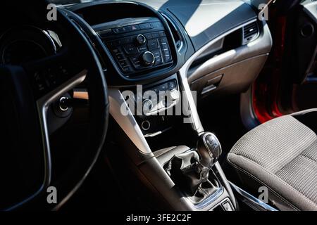 Kyiv, Ukraine - July 29, 2026: Close up view of a compact Opel Zafira car interior showing manual gear shift, dashboard controls and fabric seat. Stock Photo