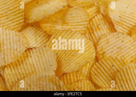 Lots of potato chips, texture close up Stock Photo