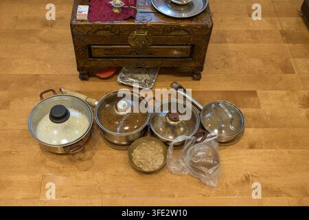 Stainless Steel Cookware Set Displayed on Hardwood Floor Stock Photo