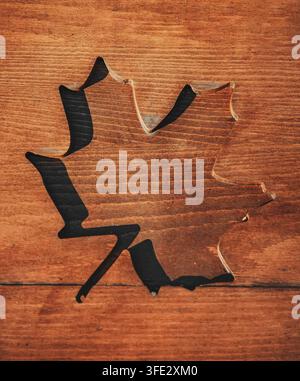 Shape of leaves carved into wooden surface Stock Photo