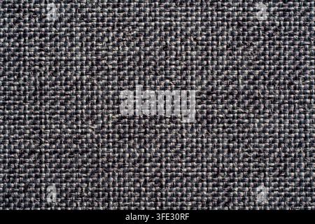 Dark grey textured fabric material close up background. Detailed close up of dark grey woven fabric texture pattern background for design and upholste Stock Photo