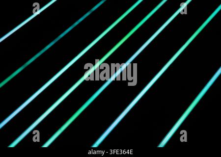 Glowing neon stripped lights on dark background Stock Photo