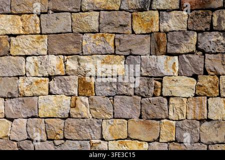 Old rustic stone wall texture background Stock Photo