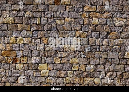 Old rustic stone wall texture background Stock Photo