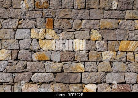 Old rustic stone wall texture background Stock Photo