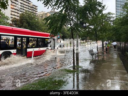 Toronto, Canada. 02nd Sep, 2026. A transit bus drives through floodwater along Yonge St. in midtown Toronto during a storm on Wednesday, Sept. 2, 2026. Credit: The Canadian Press/Ģ����ý Live News Stock Photo