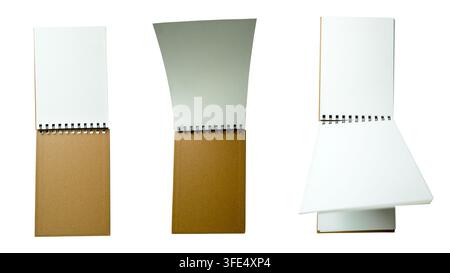 Three views of a small spiral-bound notebook with brown kraft cover and blank white pages, isolated on white background. Perfect for mockups and stati Stock Photo