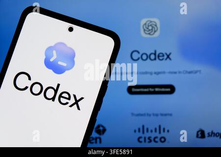 In this photo illustration, the OpenAI's AI coding agent Codex logo is seen displayed on a smartphone screen and OpenAI Codex Website in the background. Stock Photo