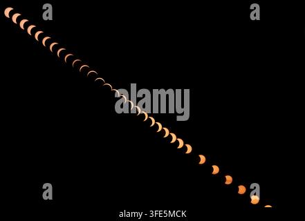 composite view of the partial solar eclipse of 2026 in Norfolk, England, United Kingdom Stock Photo