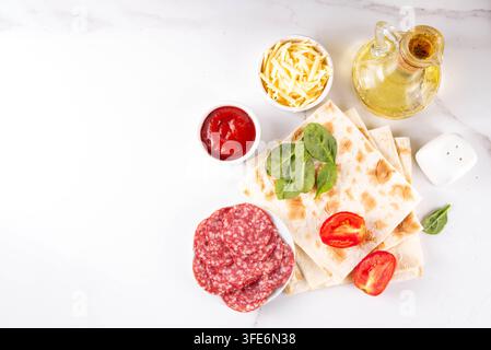 Flatbread Pepperoni Pizza. Viral pizza on tortilla pita bread, with tomato marinara sauce, grated cheese and pepperoni Stock Photo