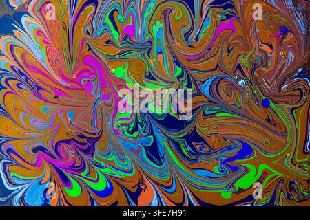 Abstract colorful acrylic paint swirls in water. Fluid art macro background with vibrant ink mix Stock Photo