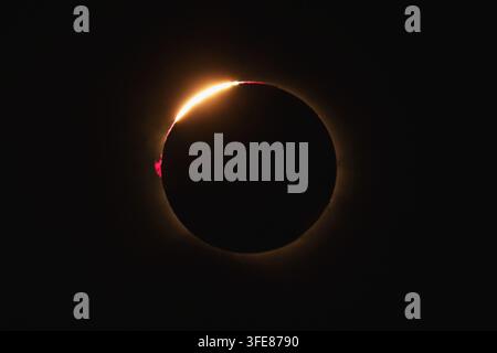 View of a total solar eclipse showing the diamond ring effect with a bright flare of sunlight emerging from behind the moon in Bellmunt del Priorat, C Stock Photo