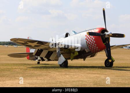 Republic P-47D Thunderbolt "Nellie B" (G-THUN) parked on the grass airfield at IWM Duxford during the 2018 airshow season. Stock Photo