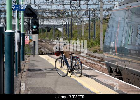 A bicycle on the platform at Nuneaton railway station, Warwickshire, UK Stock Photo