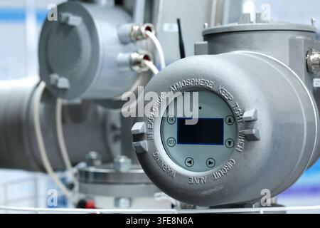 Close up of industrial digital meter in explosion proof shell. Selective focus. Stock Photo