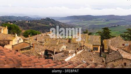 Charming Italian village rooftops on rolling hills Stock Photo