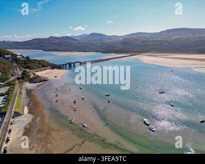 Barmouth, Gwynedd, Wales, UK – 23 August 2026: Scenic aerial view of the long timber railway bridge and footpath over the Mawddach Estuary from Cardig Stock Photo