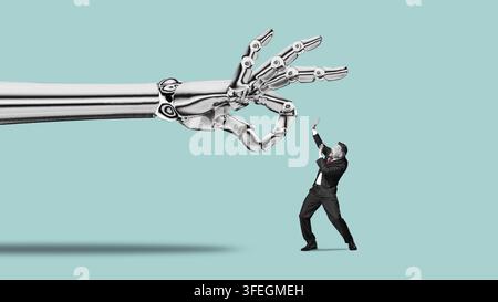 People fear AI robots. Artificial intelligence concept for businesses. A giant robot hand flicking away a tiny man. Stock Photo